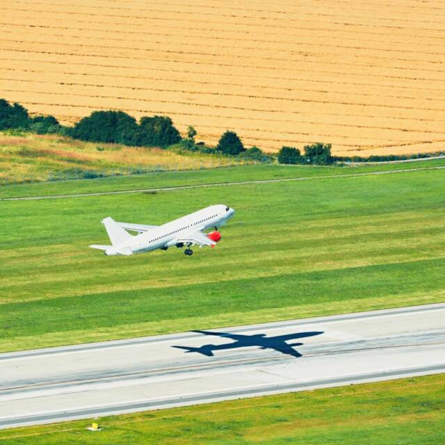 Aerial view of the airplane. Take off from the runway in Prague.